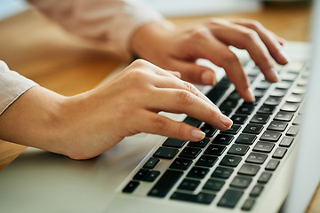 Image showing Woman typing on a laptop keyboard working on a report, email or online research for website about us information. A productive female marketing analyst hands doing seo data work with modern software