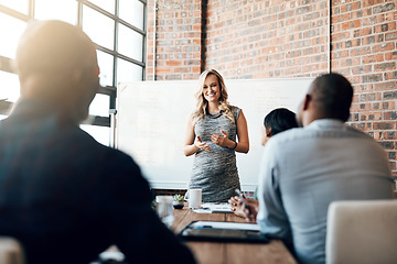 Image showing Team presentation by businesswoman, entrepreneur or leader in modern boardroom. Professional business meeting or coaching by female boss, executive or speaker for staff motivation and success.