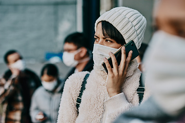 Image showing Covid travel restrictions, refuge and immigration problems at a foreign border with woman on phone call looking worried, concerned or serious. Crowd, queue or line of traveling people at the airport