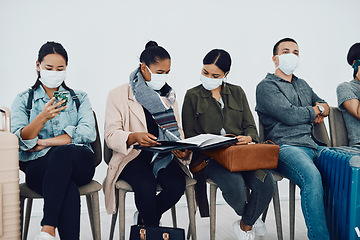 Image showing Immigration during covid with people traveling and waiting at an airport lounge during the pandemic. Foreign refugees in a public travel facility or border wearing masks in a corona virus outbreak