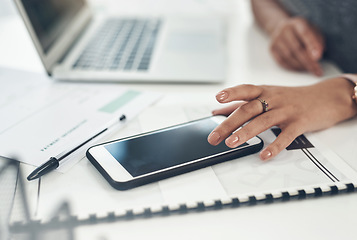 Image showing Business woman, marketing analyst and entrepreneur browsing, texting and planning on a phone with a blank screen while working in an office. Closeup of a manager checking online notifications at work