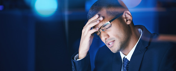 Image showing Headache, burnout and stress business man working late in corporate office. Workaholic feeling the pressure of workload and deadline, frustrated and suffering with migraine and exhausted by overtime