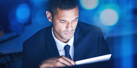 Image showing Businessman with digital tablet overtime for data research in a corporate office at night. Male entrepreneur and executive worker using technology to communicate and network with online app or email