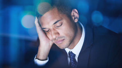 Image showing Tired, overworked and exhausted businessman sleeping while working overtime in the office at night. Fatigue, burnout and lazy corporate manager sitting at desk and taking nap in the company building.