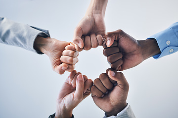 Image showing Teamwork, motivation and collaboration fist bump hands gesture, sign or icon below on studio wall background mockup. Diversity worker group or business people together in unity, solidarity and effort