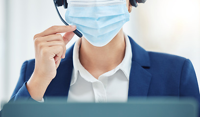 Image showing Customer support, crm and covid compliance with face mask and an agent in office or center. Operator practice safety during online communication and advice. Woman working in hygiene, safe workplace