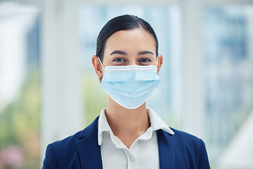 Image showing Compliance, face medical mask and covid rules at work with a business woman in corporate office. Portrait of a female worker practice social distancing at workplace, regulations and hygiene