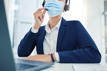 Image showing Covid call center, sales woman and marketing agent with face mask networking, talking and consulting with expert communication in office. Telemarketing, crm and business employee in corona pandemic