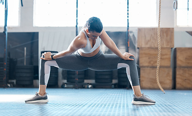 Image showing Gym, woman and stretching legs exercise before workout session training for injury prevention. Girl doing joint and muscles warm up for athlete performance and recovery from active fitness.