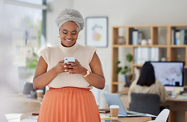 Image showing Business woman typing on social media on phone at work, reading email and networking with people online on a smartphone in an office. Happy black woman in communication on internet with technology