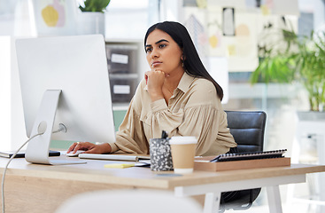 Image showing Thinking, attention and business woman on computer working by desk in design company office building. Idea, vision and innovation with employee reading email or looking at work online