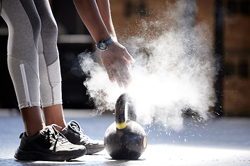 Image showing Woman powder hands, kettlebell fitness and ready for gym training, workout and exercise in healthy club. Bodybuilder athlete with power, dust and motivation prepared for heavy performance challenge