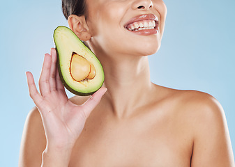 Image showing Beauty, healthcare and skincare woman avocado in hand with cosmetic wellness, health and healthy diet for clean and glowing skin. Happy portrait, smile and young model face, teeth and fruit product