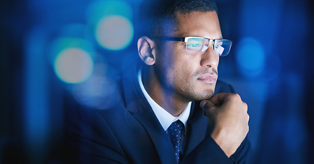 Image showing Business, office and man thinking, planning and problem solving at night in a corporate company. Serious and focused male employee in networking, big data and technology for digital innovation.