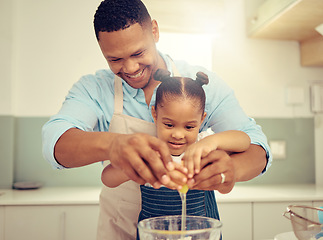 Image showing Happy black father and daughter baking in a kitchen, having fun being playful and bonding. Caring parent teaching child cooking and domestic skills, prepare a healthy, tasty snack or meal together