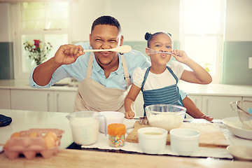 Image showing Food, cooking and family with happy black father and daughter bonding and being silly in a kitchen, Single parent teaching his child how to prepare a healthy and nutrition meal, having fun at home