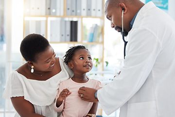 Image showing Heart doctor, mother and child at a hospital for checkup, examination or medical advice at a clinic. Black healthcare man in cardiology checking little girl patient in medicare, examine appointment.