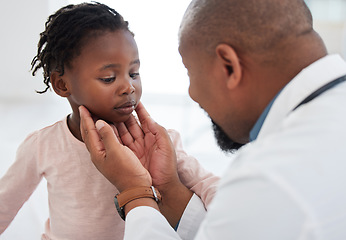 Image showing Medical doctor checking a girl throat with care in his office at a modern surgery center. Man pediatrician touching the patients neck during healthcare, medicare and illness consultation at clinic