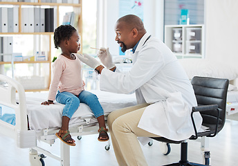 Image showing Doctor, mouth of child and black man helping little girl in checkup or consultation at a hospital. Medical male expert or pediatrician examining kid for throat infection, illness or sore in clinic.