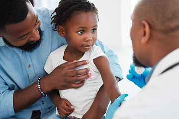 Image showing Father, child in consultation with pediatrician doctor for medical healthcare, insurance and trust. Black people, girl and men consulting appointment in hospital clinic for kid or toddler vaccination