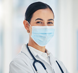 Image showing Covid doctor with face mask for safety, medicine and hygiene while working in a medical hospital or clinic. Portrait of woman nurse, healthcare expert and professional worker in corona virus pandemic