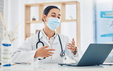 Image showing Covid, telehealth and doctor in a mask consulting on a video call in her office at the hospital while remote working. Insurance, medicine and internet appointment for trust, help and medical care