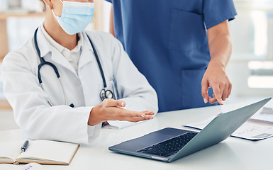 Image showing Collaboration, laptop and hands with a doctor and nurse in discussion as a team about healthcare or medical diagnosis. Teamwork, insurance and research with online resource for innovation in medicine