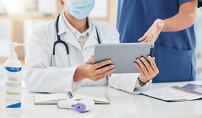 Image showing Doctor, hands and tablet with a healthcare team doing research online in a hospital for medical, medicine or wellness. Teamwork, collaboration and working together for treatment, cure and recovery