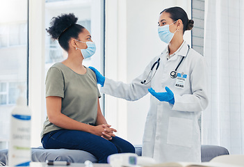 Image showing Medical nurse consulting a patient for covid before vaccine while wearing a face mask during pandemic. Healthcare worker with stethoscope discussing the virus injection with a woman in hospital room.