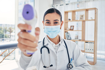 Image showing Covid doctor thermometer, safety check and corona virus risk in hospital, clinic and medical surgery. Portrait of healthcare worker consulting with face mask, wellness service test and fever laser