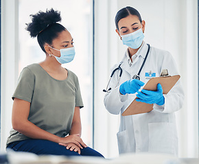 Image showing Covid, consulting and healthcare with a doctor and patient reading medical paperwork on a clipboard with test results. Insurance, medicine and help with a woman in the hospital for an appointment