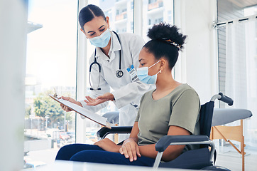 Image showing Doctor with covid patient in wheelchair for insurance, healthcare worker and nurse talking to hospital patient with disability about document and paperwork. Woman consulting with nurse before surgery