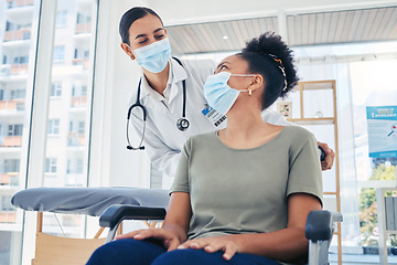 Image showing Nurse helping covid patient in a wheelchair after medical treatment in a hospital room. Healthcare employee helping a disabled person in the clinic ward. Doctor consulting woman with coronavirus.