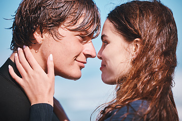 Image showing Young couple hug and sharing an intimate moment at the beach together, happy and carefree. Young boyfriend and girlfriend bonding, embracing, romantic and showing affection, enjoying summer fun