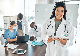 Image showing Portrait of happy doctor with digital tablet in a planning meeting with healthcare workers in an office. Medical expert research on laptop during teamwork, collaboration and support strategy online