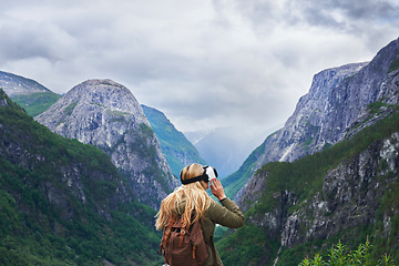 Image showing Adventure woman wearing vr headset augmented virtual reality in beautiful mountain landscape concept