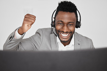 Image showing Call center, customer service or telemarketing worker with celebration, winner and motivation while working in an office. Excited happy businessman celebrating success of sale target and goal to win