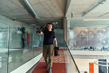 Image showing A videographer arrives to recording promotional footage for the company, embodying creativity, innovation, and the essence of contemporary marketing strategies.