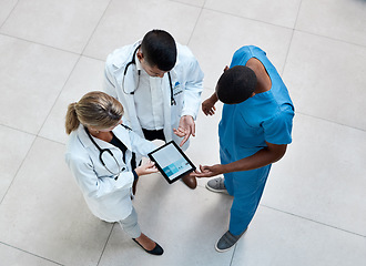 Image showing Doctor, nurse and healthcare team with a tablet working with digital medical data in a hospital. Technology, tech and internet information of health and wellness clinic workers planning a surgery