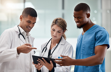 Image showing Medical, doctor and nurse team with a tablet working on medicine and hospital data. Collaboration of health and wellness staff healthcare workers with diversity looking at healthy web test results