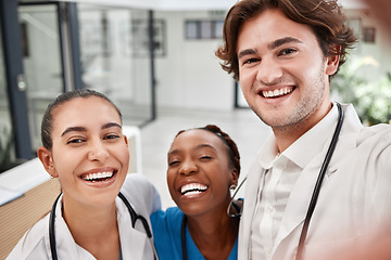 Image showing Healthcare, hospital and doctors taking selfie, bonding while working together and having fun. Medical intern posing for a picture, smiling and laughing, enjoying diverse friendship at the workplace