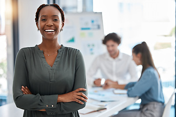 Image showing Portrait of a happy woman standing in a corporate office during a team analysis meeting. Black professional businesswoman discussing and analyzing a creative project in the company conference room.