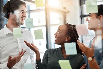 Image showing Teamwork, diversity and brainstorming with sticky notes in workshop or presentation. Coaching, training and man sharing idea with women at startup. Strategy, planning and collaboration to reach goal.