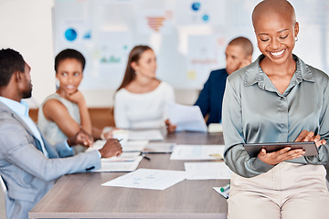 Image showing Business woman working on digital tablet while in team meeting analyzing documents and paperwork. Diversity, corporate and professional group of people doing research and planning a project in office