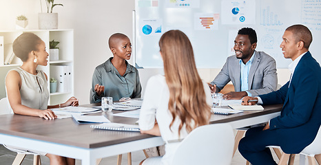 Image showing Business people planning, collaboration and teamwork on a startup project in an advertising or marketing company. Team of professional workers working on strategy with data documents or paperwork