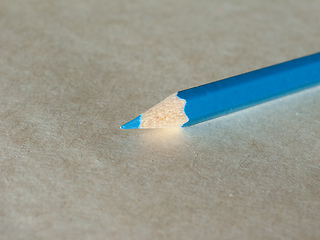 Image showing Blue pencil over paper