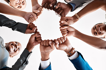 Image showing Hands, collaboration and motivation with a business team in a huddle with fists and a mindset of company vision. Mission, teamwork and goal with a group in a circle ready for growth and development