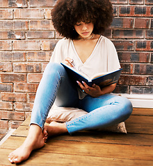 Image showing Woman reading books, story and study at home for relaxed learning, studying and education. College student, young black person on ground and interesting story for research, literacy and knowledge