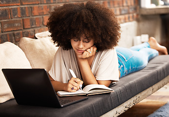 Image showing Education, learning and writing with a woman student studying online with her laptop on a sofa in her home living room. Study, growth and development with a female learner taking notes for an exam