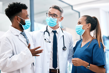 Image showing Doctor, nurse and covid with a team of healthcare or medical workers working together in collaboration in a hospital. Mask, teamwork and insurance with professional medicare personnel in a clinic